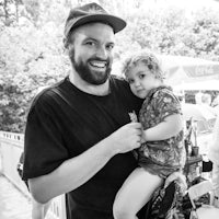 black and white photo of a man holding a child